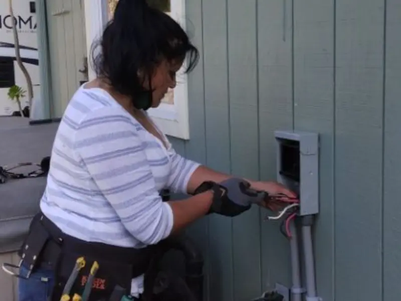 Licensed electrician wiring an exterior subpanel in Calimesa